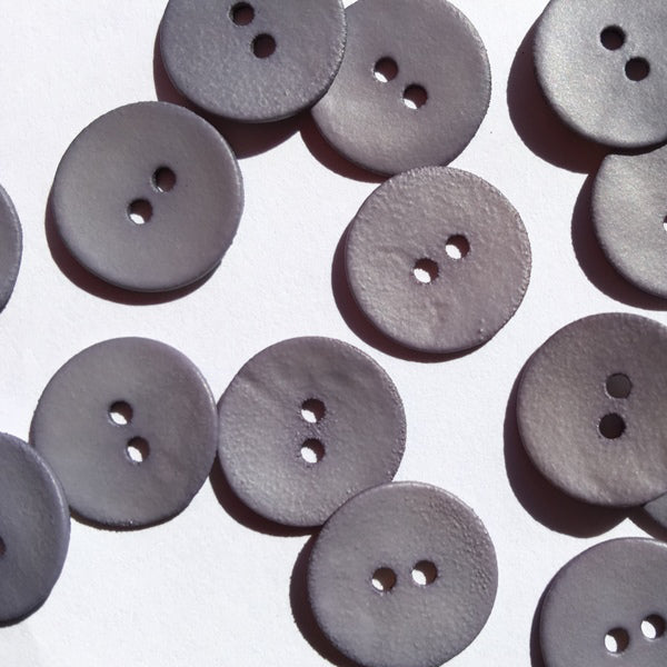 Matt grey shell button