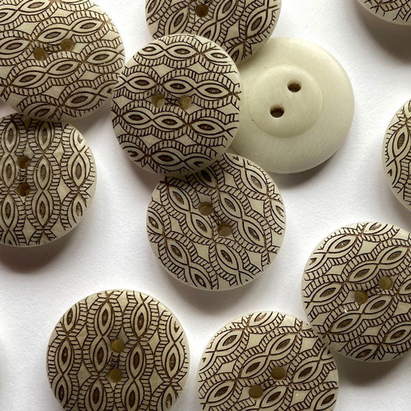 Natural Corozo nut button with brown laser pattern