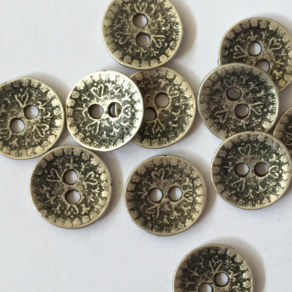 Zinc like metal button with embossed design