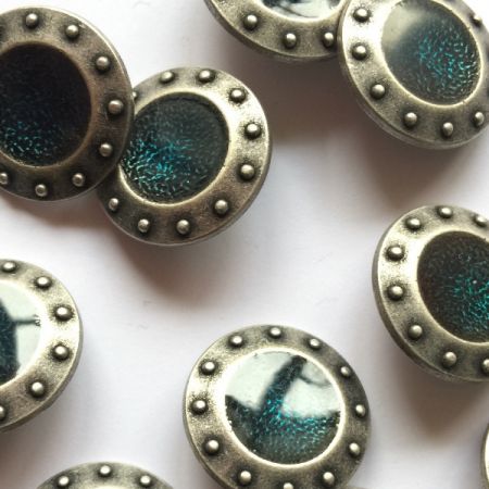 Pewter colour metal bobble edge button with teal green/blue resin centre