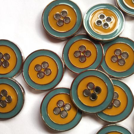 Silver rim metal button with green, blue & mustard yellow enamel